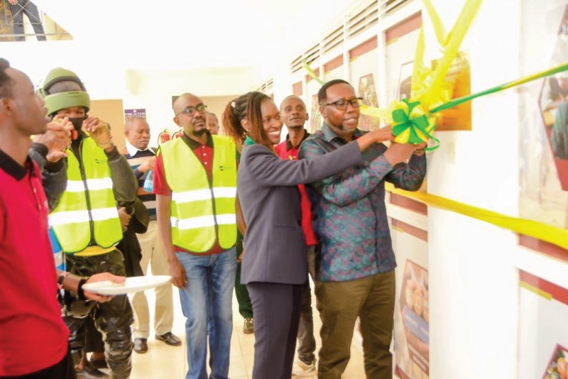 Fortune Credit cutting a ribbon at the opening of the Eldoret Branch
