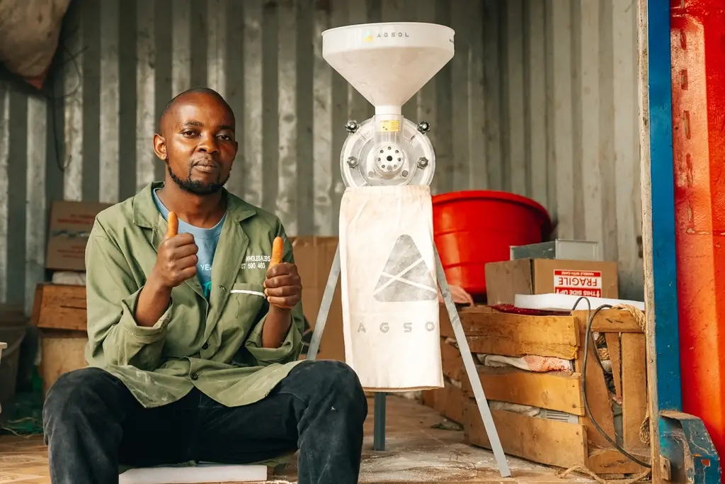 A man with an Agsol product he got a loan for