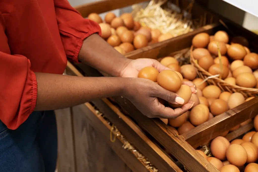 A woman holding eggs