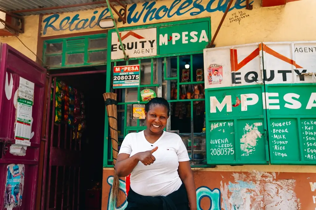 A woman stands outside her retail and wholesale store