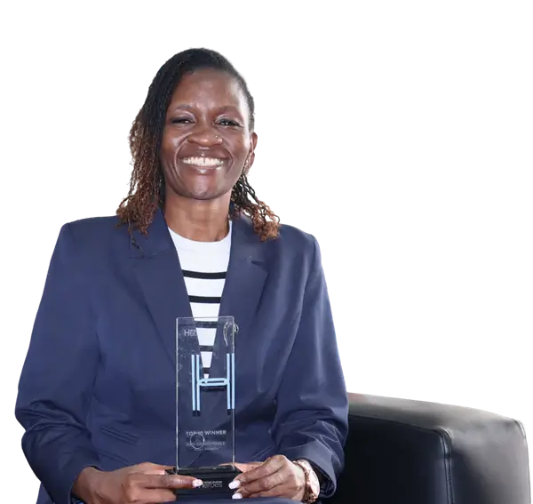 Janet Kuteli holding an Africa Business Heroes Award