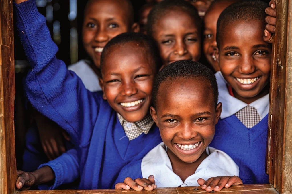 Learners in school uniform attending class through education support provided by Fortune Credit EduFinance Loan in Kenya