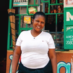 Lilian Bochaberi stands outside her small business
