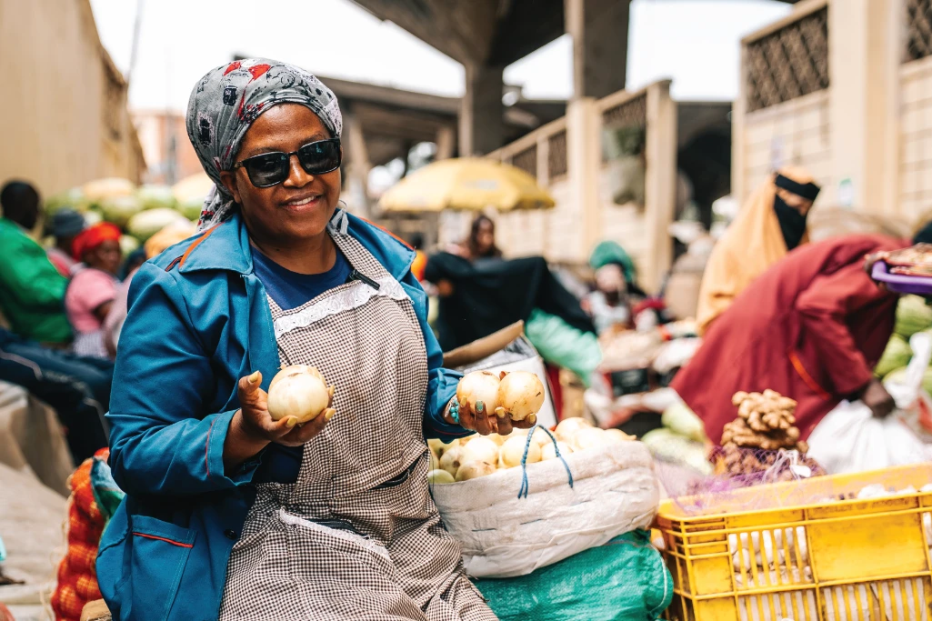 Mama Mboga selling fresh vegetables