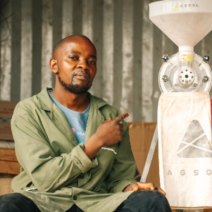 Paul Kariuki with his mill for maize