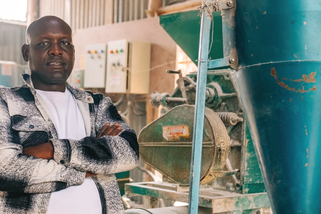 Posho mill operator running a small-scale milling business financed through Fortune Credit Business Loan for SME growth in Kenya